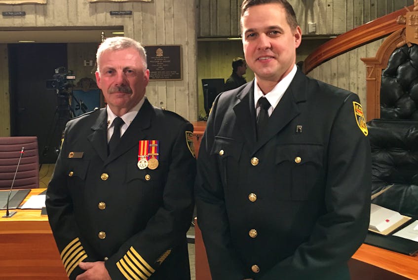 St. John’s Regional Fire Department Chief Jerry Peach (left) and firefighter Terry Edwards at St. John’s City Hall on Monday.