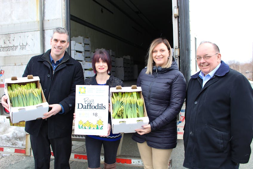 Preparing for daffodil deliveries are (from left) Matthew Piercey, chief executive officer of the Canadian Cancer Society NL, Sarah Neil, community relations co-ordinator of the Canadian Cancer Society NL, volunteer Nicole George and Al Pelley, vice-president of philanthropy, Canadian Cancer Society NL.