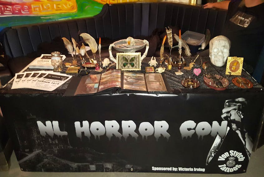 The NL Horror Con table display at Velvet nightclub during Here Kitty Kitty Productions’ horror-themed burlesque show.