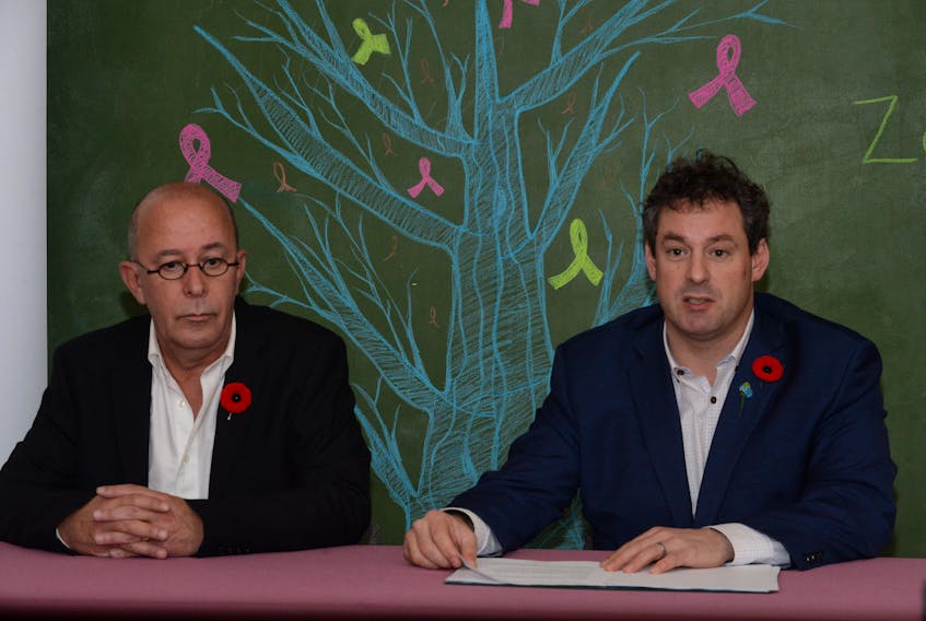 St. John’s East MP Nick Whalen (right) and AIDS Committee of NL executive director Gerard Yetman speak to reporters in St. John’s Friday.