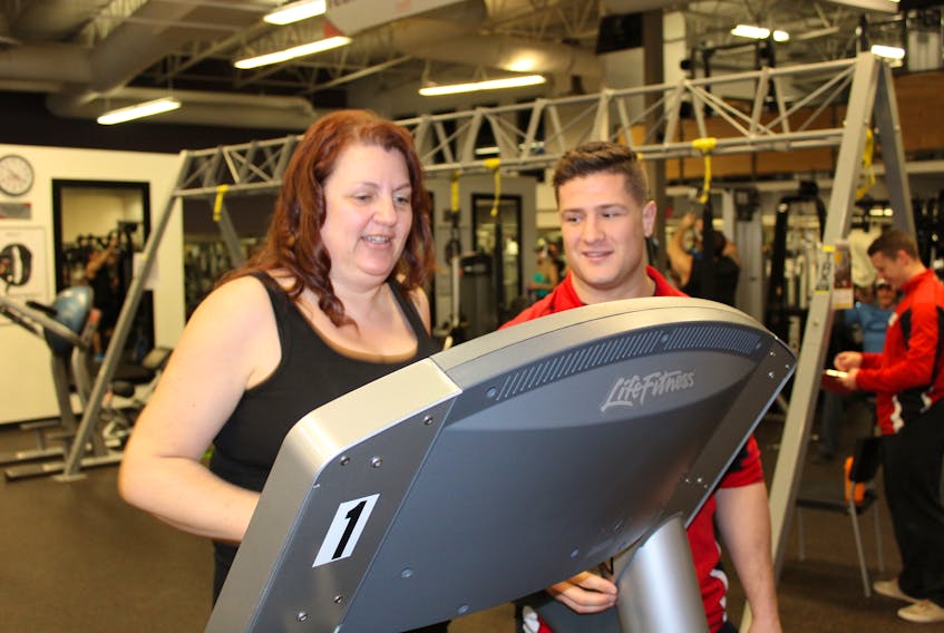 Chris Hammond of Good Life Fitness in Mount Pearl gives Cindy Barnes a last-minute pep talk before she embarks on her run as part of her workout and fitness regime.
