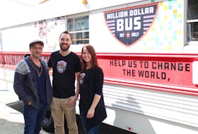Jody Williams (left) of Bridges to Hope stands with the Million Dollar Bus’s Ryan Lancaster (centre) and Mandy Glinsbockel in St. John’s. The Million Dollar Bus duo is teaming up with Bridges to Hope for a campaign to promote healthier eating for kids.