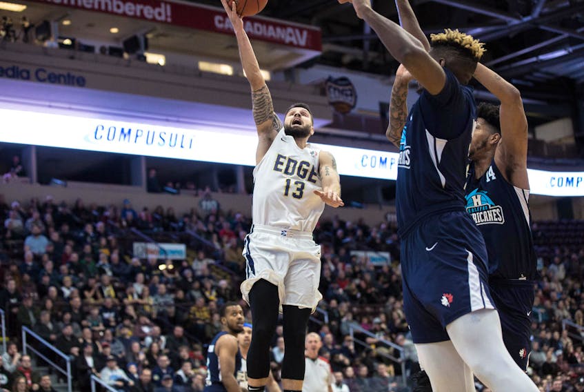 Jeff Parsons/St. John's Edge - Diego Kapelan of the St. John’s Edge drives to the net against a pair of Halifax Hurricanes defenders during NBL Canada play Thursday night at Mile One Centre.