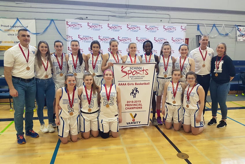 Holy Heart Highlanders won the provincial 4A high school girls’ basketball championship Sunday, beating the Holy Trinity Tigers 67-62 in the final. Members of the winning team are, from left, first row: Delia Barrett, Kaitlyn Hall, Ella Banfield, Kirsten Yetman, Megan Ryan; back row: coach Colin McNeil, assistant coach Geana George, Laura Quigley, Meaghan Quigley, Abby Sparrow, Erin Long, Carly Stevenson, Aluel Achiek, Emma Cachia, Norah Quinlan, coach Peter Sparrow and manager Shauna Foley.