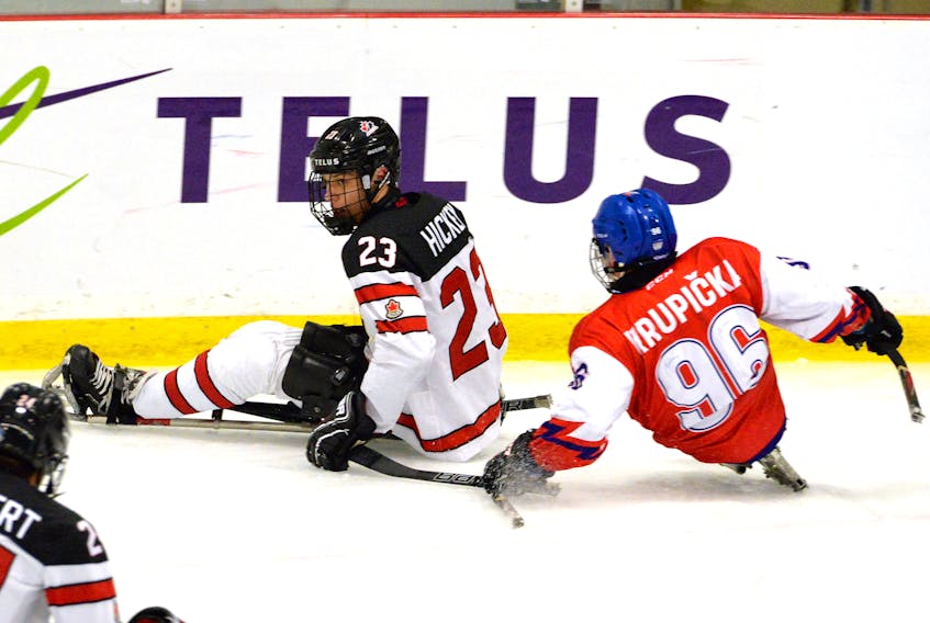 St. John's native Liam Hickey (23) moves ahead of the Czech Republic's Zdenek Krupicka during the teams' opening game of the Canadian Tire Para Hockey Cup Sunday night at the Paradise Double Ice Complex, Hickey scored twice in Canada's 6-0 victory. — Keith Gosse/The Telegram