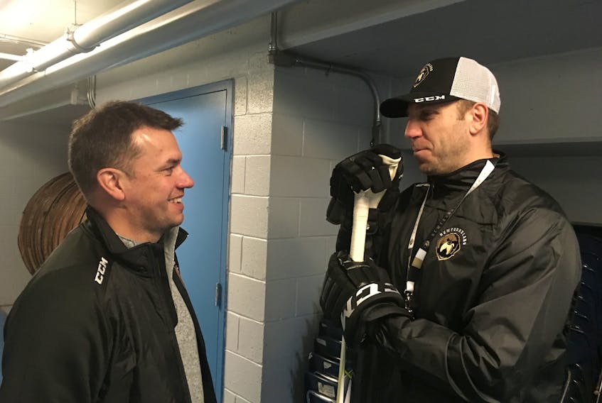 Newfoundland Growlers head coach Ryan Clowe (right) talks to Trevor Murphy, the ECHL team’s director of hockey operations, after a Tuesday practice at the Glacier in Mount Pearl.