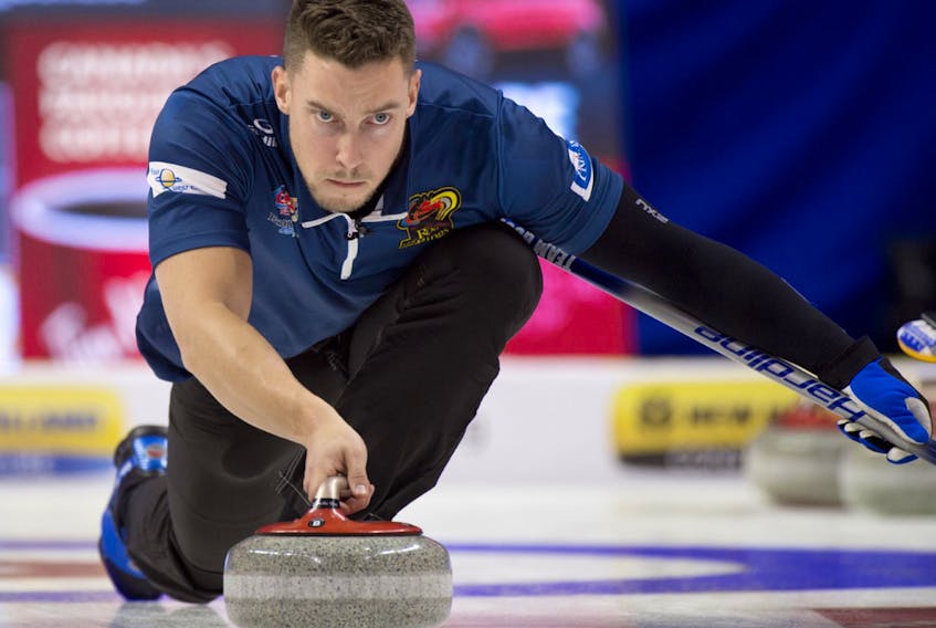 Michael Burns/Curling Canada — Team Gushue second Brett Gallant concentrates on making a throw during play at the Tim Hortons Roar of the Rings Olympic Curling Trials, being held this week in Ottawa.