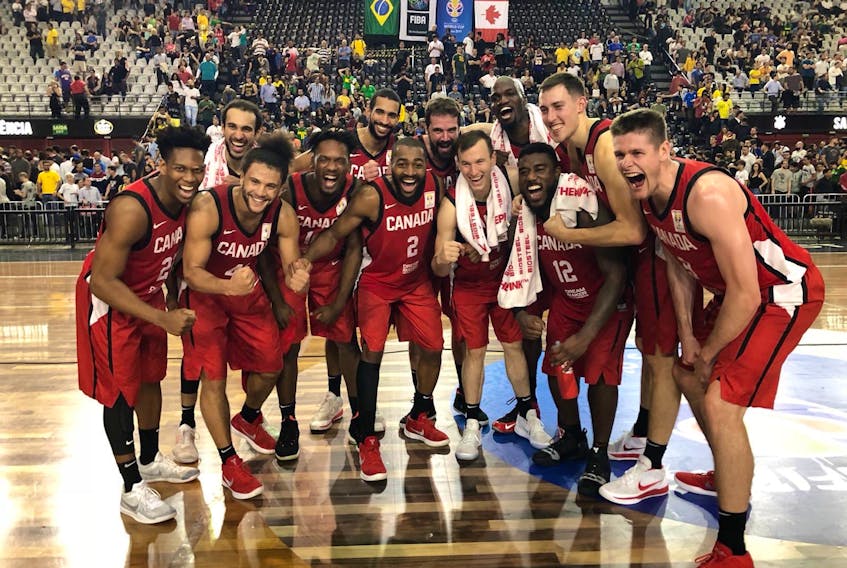 Members of the Canadian men’s basketball team celebrate after a 94-67 win over Brazil Monday in Sao Paolo, a result that earned Canada a place in the 2019 World Cup of Basketball. — Basketball Canada/Twitter