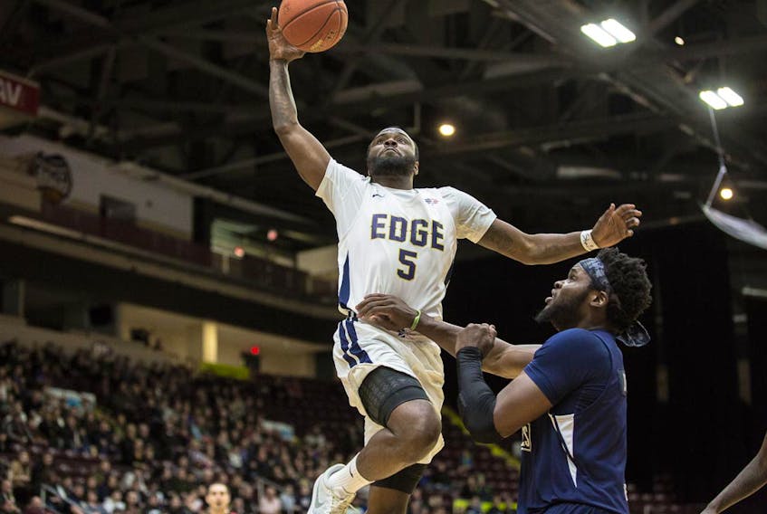 With Obinna Oleka signing with a club in a Mexican league, Dez Lee (5) becomes the St. John’s Edge’s top rebounder among active players, in addition to being the team’s leading scorer. — St. John’s Edge photo/Jeff Parsons