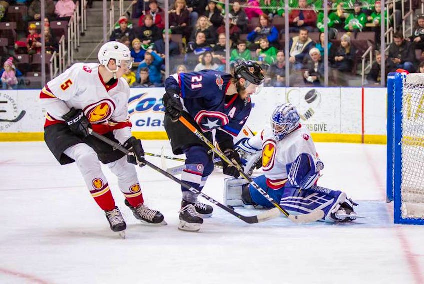In this Feb. 9, 2019 file photo, Newfoundland Growlers goalie Eamon McAdam foils Fort Wayne Komets forward Marco Roy on a scoring play as Growlers defenceman Kristians Rubins moves in during an ECHL game at Mile One Centre. The Newfoundland players were wearing Iron Man-themed jerseys as part of a Marvel Super Heroes promotion. The Growlers will be wearing super hero jerseys agains tonight as they take on the Worcester Railers at Mile One Centre, but this time, it will based on a character from the DC comic universe. — Newfoundland Growlers photo/Jeff Parsons