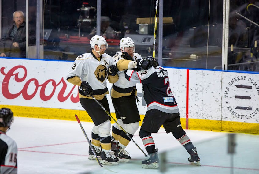 Newfoundland Growlers captain James Melindy (43) appears to be frustrated with Brampton Beast defenceman Chase Golightly as Growlers teammate Adam Pardy looks on during second-period ECHL play Wednesday night at Mile One Centre.