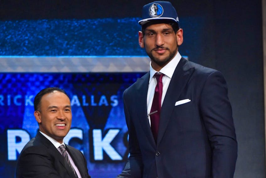 Satnam Singh is congratulated by National Basketball Association deputy commissioner Mark Tatum after being selected by the Dallas Mavericks with the 52nd overall pick of the 2015 NBA Draft. Singh has signed a one-year contract with the National Basketball League of Canada’s St. John’s Edge. — File/nba.com