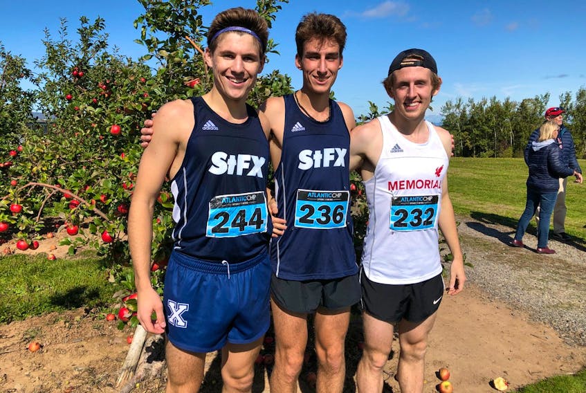 The Memorial Sea-Hawks’ Levi Moulton (right), who finished third at the Acadia Invitational AUS cross-country meet on Saturday, poses with first-place finisher Jacob Benoit (236) and runner-up Graydon Staples after the race in Wolfville, N.S. — Acadia University Athletics