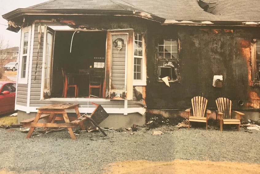 The back of Trent Butt’s Carbonear home after he set it on fire with himself and the remains of his daughter inside.