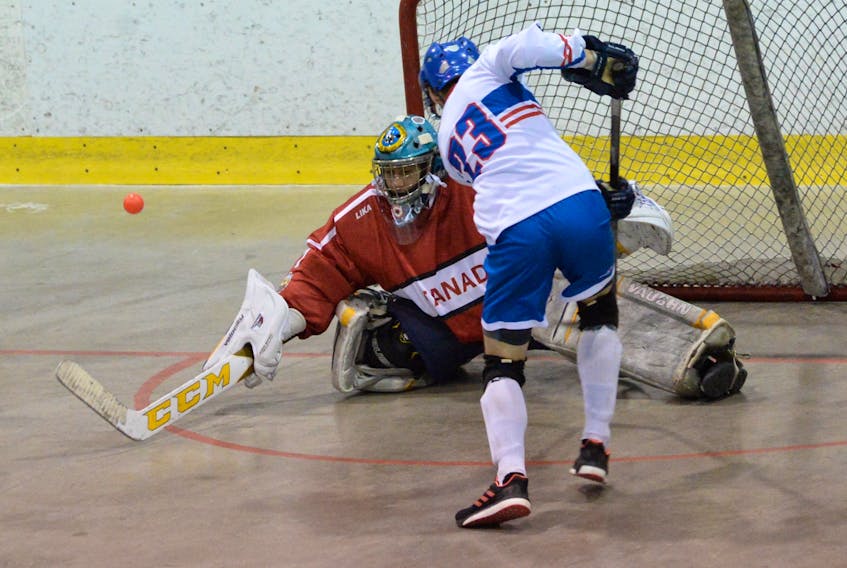 Canadian goaltender Chris Curr turns aside a shot by the Czech Republic’s Jakub Vobruba (23) during the championship final in the under-20 division of the world junior ball hockey championships Sunday at the Mount Pearl Glacier.