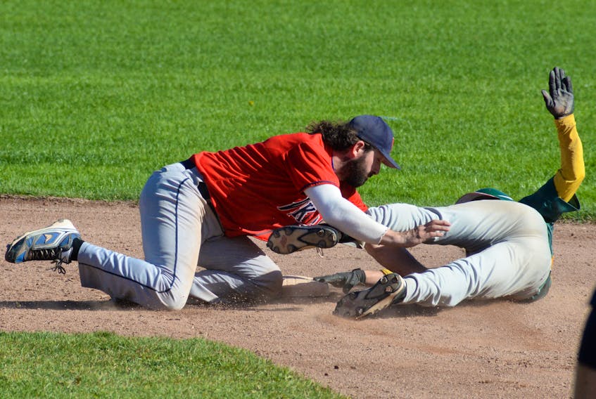Gonzaga Vikings shortstop Gerald Butt (left) applies the tag to the Shamrocks’ Josh Langmead at second base during St. John’s Molson senior baseball play Monday afternoon at St. Pat’s Ball Park. Langmead was called out on the play.