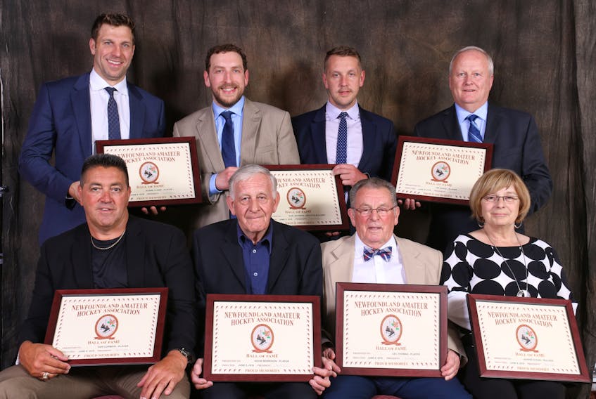The seven new members inducted into the Hockey Newfoundland and Labrador Hall of Fame Saturday night, or their representatives, are (from left) first row: Dan Cormier, Art Barry (representing Kevin Morrison), Cec Thomas, Bonnie Evans; second row: Ryane Clowe, Graham and Doug Jackman (representing their late father, Bob Jackman) and Jim Heale.