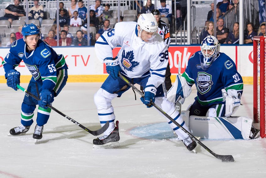 Colin Greening (38), shown in action for the Toronto Marlies in their season-opening game against the Utica Comets, now has seniority among Newfoundlanders playing in the pro ranks.