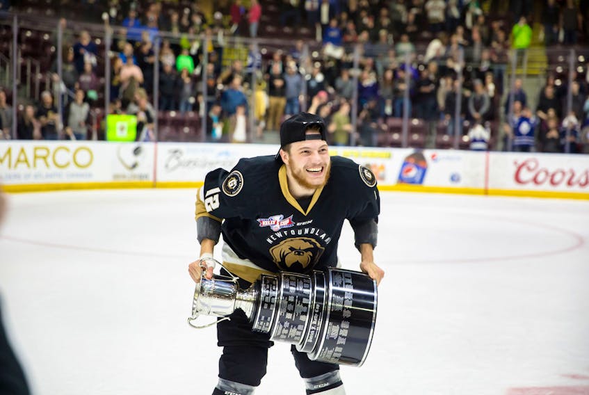 In this file photo, Newfoundland Growlers forward Scott Pooley celebrates with the Kelly Cup at Mile One Centre after the Growlers defeated the Toledo Walleye in a six-game ECHL championship final. Pooley and other returning members of the team will have a reunion with the trophy as the Growlers open their 2019-20 season tonight at Mile One against the Reading Royals. The Kelly Cup — actually two versions of the Kelly Cup — will be part of celebrations that will be highlighted by a banner-raising before the game. — Newfoundland Growlers photo/file