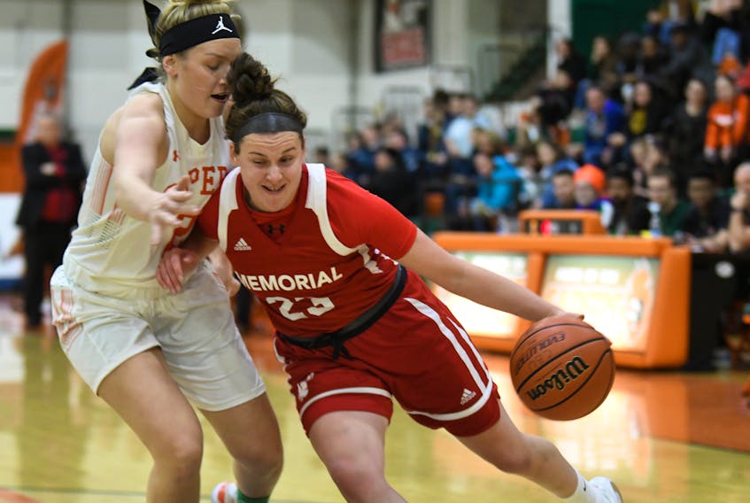 The Memorial Sea-Hawks' Haillie Nickerson (right) had plenty of drive against the Cape Breton Capers Sunday, scoring 42 points in Memorial's second straight win over Cape Breton in Sydney, N.S. — Cape Breton Athletics photo/Vaughan Merchant