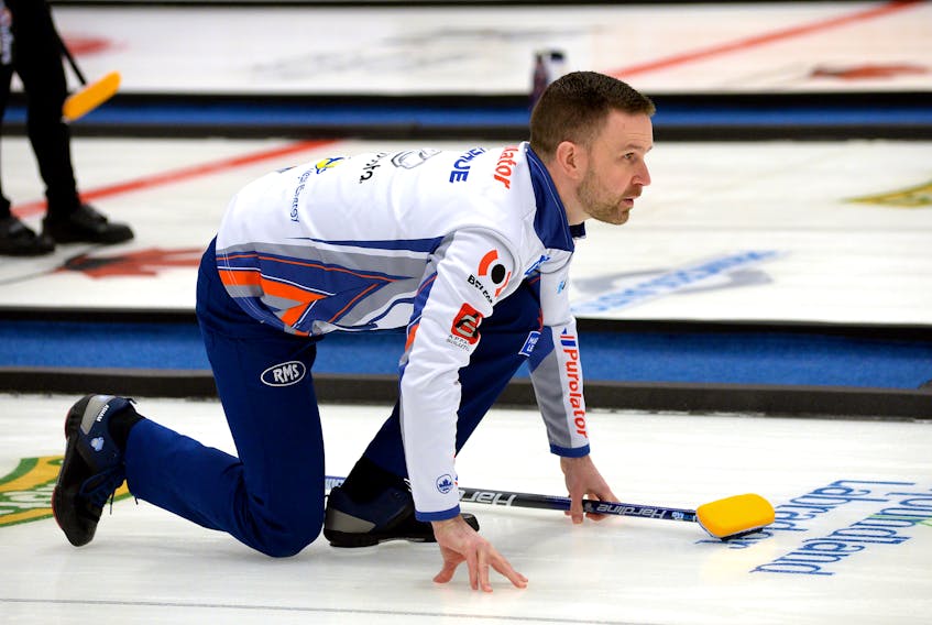 Brad Gushue follows the line of one of his shots during a game against Switzerland’s Yannick Schwaller Tuesday night in the opening draw of the National, a Grand Slam of Curling event being played at the Conception Bay South Arena. Schwaller won 8-6 in an extra end.
