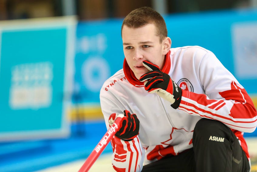 Canadian skip Nathan Young contemplates a shot during a mixed team curling preliminary-round game against Spain at the 2020 World Youth Olympics in Lausanne, Switzerland on Monday. — World Curling Federation photo