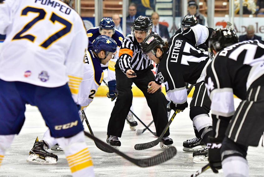 Manchester Monarchs centre Matt Leitner (17) and Tommy Schutt of the Norfolk Admirals prepare for the opening faceoff in an ECHL game in Manchester, N.H., earlier this season. The ECHL announced Tuesday that it has formally approved an expansion franchise for St. John’s, which becomes the latest ex-AHL city — Manchester and Norfolk are two others — to join the minor-league circuit. — Manchester Monarchs/Dave Hilton/Facebook @Monarchs Hockey