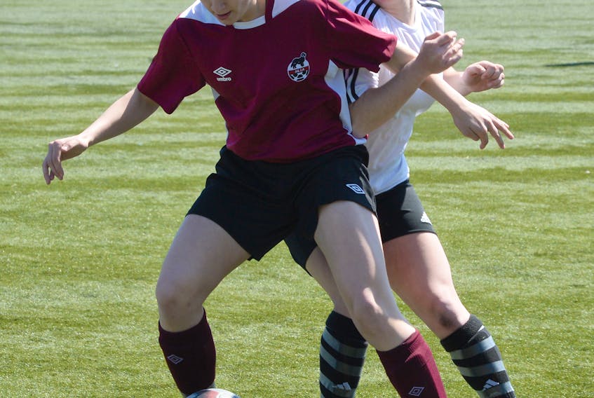 Newfoundland and Labrador’s Mallory Martin of Labrador City jostles with her Nova Scotia opponent during a game at the Atlantic Under-18 Soccer Showcase Saturday.