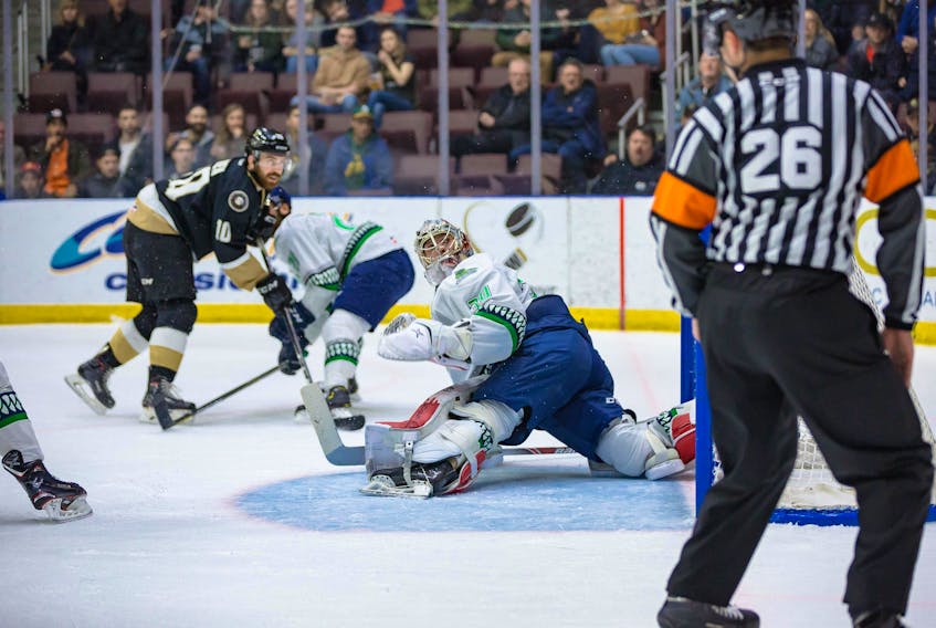 Newfoundland Growlers forward Zach O’Brien (10) and Florida Everblades goaltender Callum Booth track of puck after Booth made a save during Game 3 of the ECHL Eastern Conference final Wednesday night at Mile One Centre. Florida won 5-4, leaving Newfoundland with a 2-1 lead in the best-of-seven series. The Growlers had trailed 4-2 in Wednesday’s contest, then battled back to make it 4-4, only to watch Florida’s Blake Winiecki score the game-winner with his second goal of the night at 16:42 of the third period. Games 4 and 5 of the series will be played Friday and Saturday at Mile One. — Newfoundland Growlers photo-Jeff Parsons