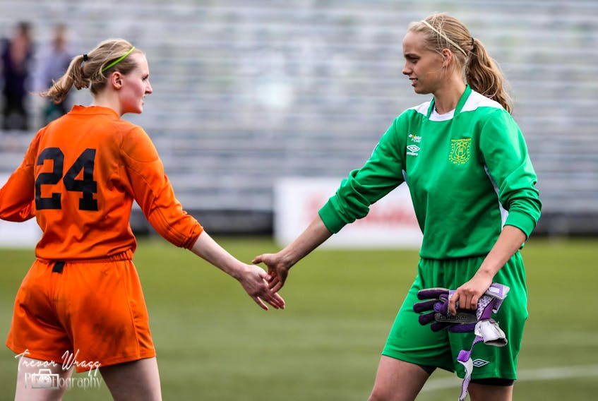 In this photo from the 2018 Breen’s Jubilee Trophy women’s soccer league championship game between Holy Cross Avalon Ford and C.B.S. Kirby United, goalkeepers Jaime Crocker (right) of Holy Cross and Sydney Walsh of Kirby congratulate each other after a 2-1 Holy Cross win. Crocker is back with Holy Cross this season, while Walsh is with Feildians as Kirby did not return to the league. Between them, the two have been responsible for the majority of the many shutouts in the league this season. Of the 27 results posted in the league so far in 2019, 22 have seen some team registering a shutout victory. Walsh had a shutout going against Holy Cross Monday at King George V Park, but lightning in the area meant the game was suspended at the 50-minute mark with Feildians leading 1-0. The remainder of the contest will be played at a later date. — Trevor Wragg photography