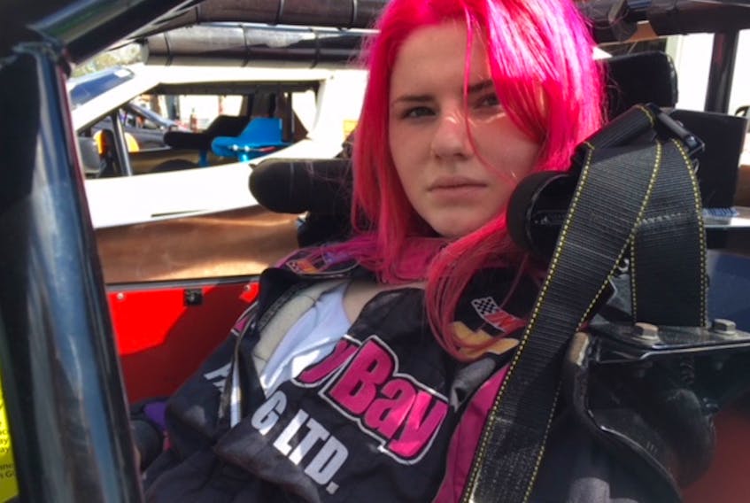Sara Thorne sits in her Bandolero class car at INEX Winter Nationals at the Citrus County Speedway in Inverness, Fla.
