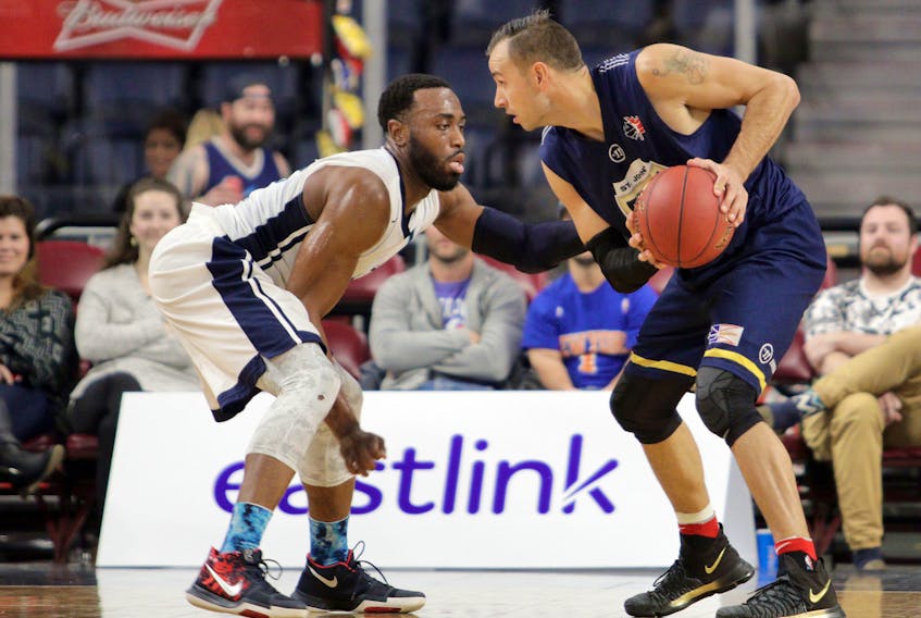 Eric Wynne/Chronicle Herald— The St. John’s Edge's Carl English (right) looks to go around the Halifax Hurricanes’ Antoine Mason during NBL Canada action in Halifax on Sunday. English had a game-high 36 points, while Mason had a team-leading 30 for the Hurricanes, who won 124-121.