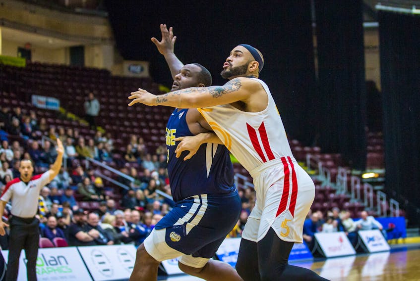 Former St. John’s Edge player Grandy Glaze (right) of the Sudbury Five played tough against Glen Davis and the Edge Wednesday night, scoring a game-high — and for Glaze, a season-high — 36 points in a National Basketball League of Canada matchup at Mile One Centre. However, it wasn’t enough to prevent St. John’s from prevailing in a 120-98 decision, the Edge’s fifth straight win and second straight over Sudbury. Davis, had 16 points and eight rebounds in 22 minutes of play, by far the most floor time the former NBAer has seen in his four games since signing with St. John’s. — St. John’s Edge photo/Jeff Parsons
