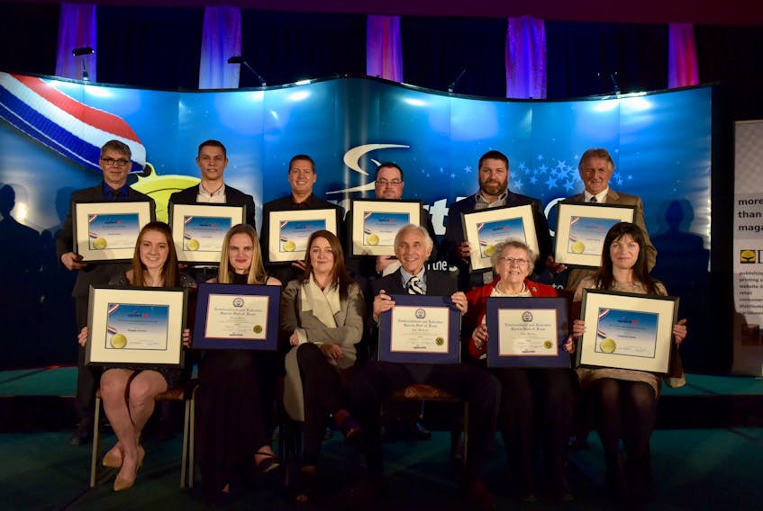 Photo by Melanie Courage — Winners and new Hall of Famers recognized at Sport Newfoundland and Labrador’s Stars and Legends Awards Gala were, from left, first row: Maggie Connors, Laura Breen, Raeleen Baggs (representing her father, Ben Dunne), John McGrath, Helen Slaney (representing her son, John Slaney), Maria Clarke (representing her son, Campbell Clarke); back row: David Coates, Liam Hickey, Scott Critch, Ryan Garland (representing Kevin Higgins), Peter Densmore and Fred Healey (representing his daughter, Heather Healey).