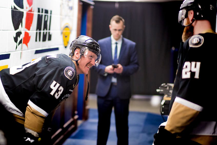 Newfoundland Growlers captain James Melindy talks with fellow defenceman Alex Gudbranson (24) outside the dressing room prior to stepping onto the ice for an ECHL playoffs game at Mile One Centre. — Newfoundland Growlers photo/Jeff Parsons