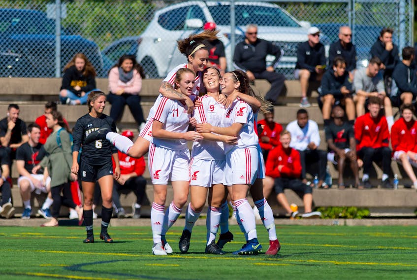 The Memorial Sea-Hawks’ Nicole Torraville (9) is congratulated by teammates after scoring a goal against the Dalhousie Tigers in Atlantic University Sport women’s soccer play in Halifax on Sunday. Torraville’s tally proved to be the only one of the game, which saw Memorial post its second 1-0 win in a row. The Sea-Hawks had defeated the Saint Mary’s Huskies by the same score on Saturday.