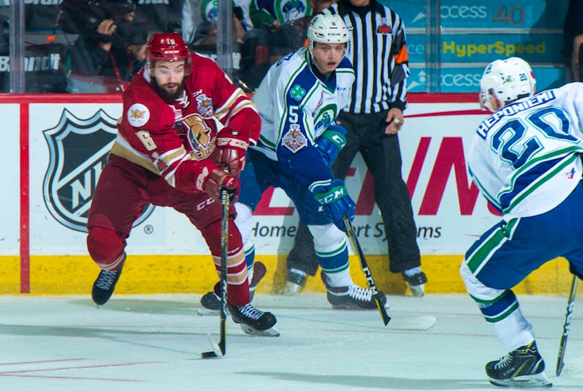 Jordan Maher (left), is shown in action for the Acadie-Bathurst Titan against the Swift Current Broncos during the Memorial Cup last week in Regina. The day after the Titan won the Memorial Cup, word emerged that they were trading Maher, who would be an overage junior next season, to the Halifax Mooseheads. Halifax is hosting the 2019 Memorial Cup. — CHL photo