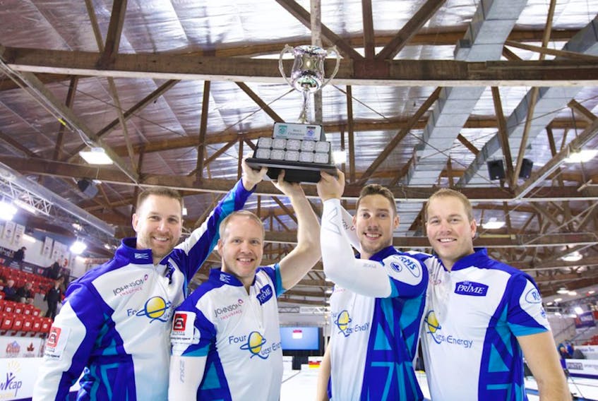 From left, Brad Gushue, Nark Nichols, Brett Gallant and Geoff Walker hoist the championship trophy after winning The Masters Grand Slam of Curling event Sunday in Lloydminster, Sask.