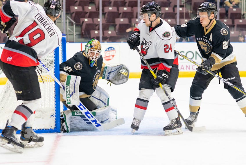 In this Oct. 17, 2018 file photo, Newfoundland Growlers goalkeeper Michael Garteig stops a shot by the Adirondack Thunder’s Shane Conacher as Growlers’ defenceman James Melindy (43) and the Thunder’s Dennis Kravchenko look on during ECHL play at Mile One Centre. Garteig has allowed just six goals in his four starts on Newfoundland’s current road trip, which continues tonight in Glens Falls, N.Y., where the Growlers face the Thunder. — Newfoundland Growlers photo/Joe Chase