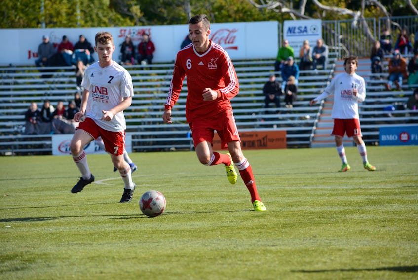 Memorial Sea-Hawks midfielder Ryan Farrell (6) moves the ball downfield ahead of Matt Quigley (7) of the UNB Varsity Reds during an Atlantic University Sport men’s soccer game at King George V Park in St. John’s earlier this season. Memorial and UNBVwill meet up again in an AUS quarter-final playoff game in Sydney, N.S., on Thursday. The Memorial women’s soccer team has also advanced to the playoffs, but has a bye through to the semifinals.