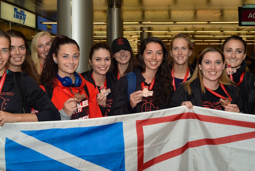 In this file photo, members of the Holy Cross senior women’s soccer team pose with their bronze medals after returning from the 2017 Jubilee Trophy Canadian senior women’s championship in Surrey, B.C.. Holy Cross is back at the nationals this year and will be looking to improve the colour of their medals in a tournament that begins today in Saskatoon. — Telegram file photo/Joe Gibbons