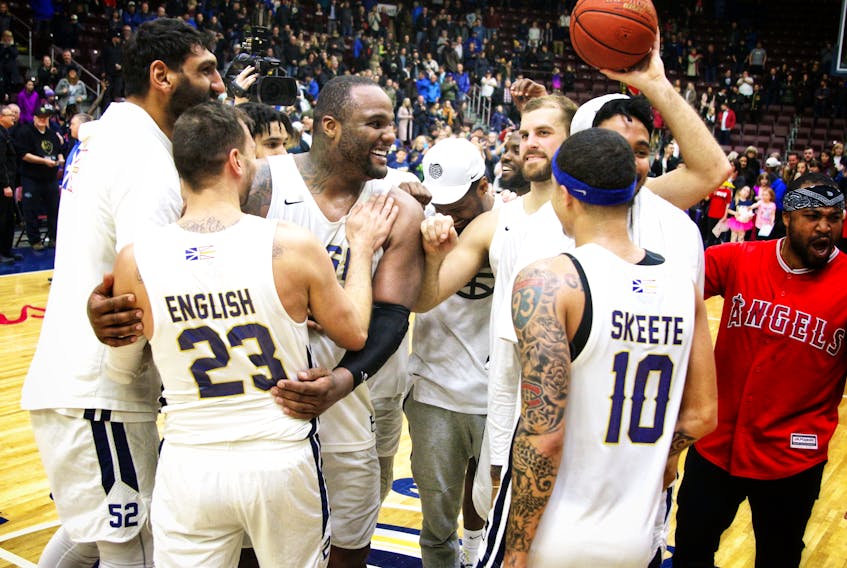 Jeff Pelletier/Special to The Telegram — Members of the St. John’s Edge, from left Satnam Singh, Carl English, Glen Davis, Murphy Burnatowski (beard) and Jarryn Skeete celebrate their win over the KW Titans Friday night at Mile One Centre, which propelled them to the NB: Canada final.