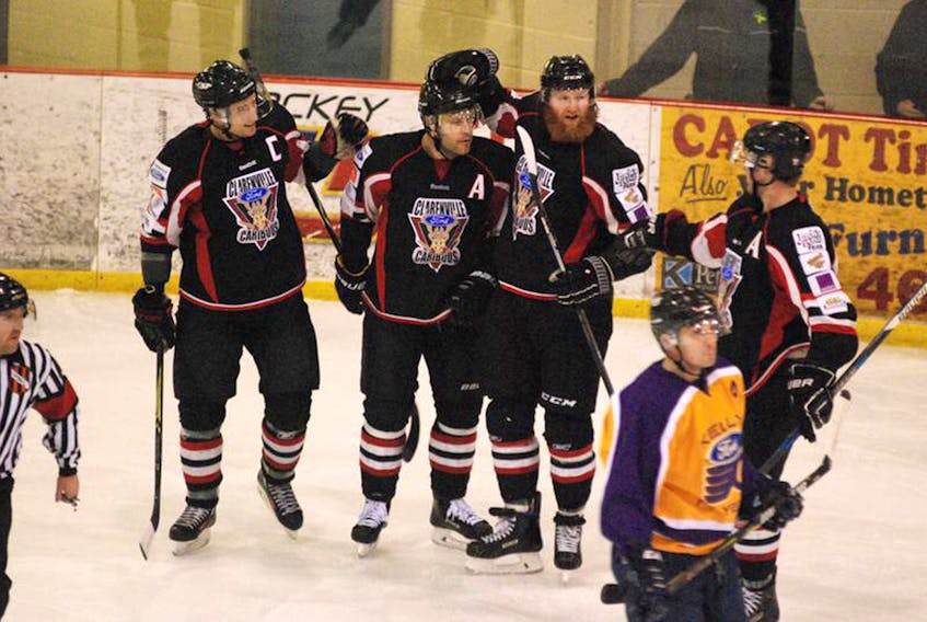 Jonathan Parsons/The Packet — The Clarenville Caribous’ Ryan Dserosiers scored the Central West Senior Hockey League’s first goal of 2018 Saturday night in a 6-3 win over the visiting Gander Flyers. Celebrating the shorthanded goal are (from left) Dustin Russell, Desrosiers, Justin Pender and Brandon Roach.