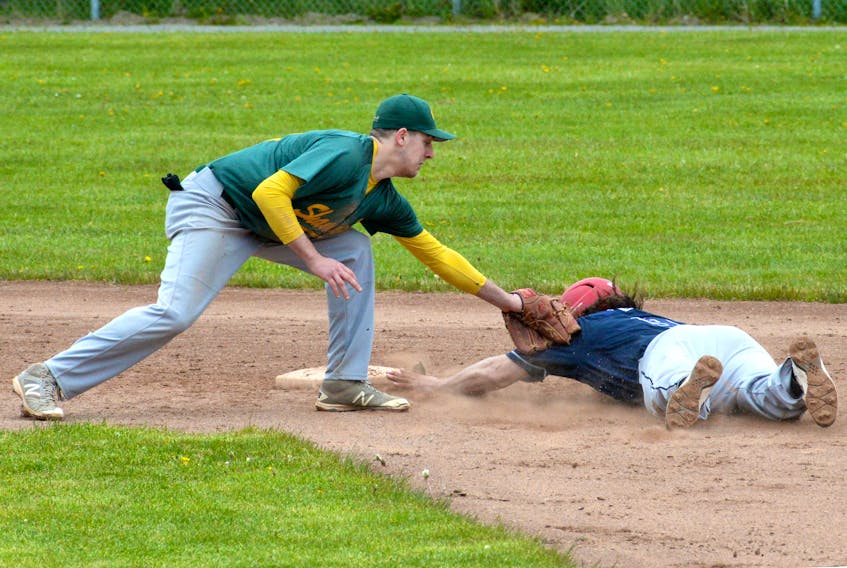 Gerald Butt of the Roebothan McKay Marshall Vikings in out at second base on a tag by the OMT Shamrocks’ Dylan McKenzie during their game on Saturday, the opening day of play for the St. John’s Molson Senior Baseball League’s 2018 season at St. Pat’s Ball Park. In a rematch of last year’s league final, the defending champion Shamrocks edged the Vikings 7-6. In Saturday’s other game, Holy Cross defeated the Knights 11-1 in a game abbreviated to five innings.