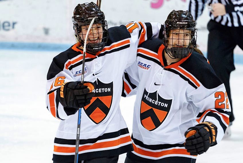 The Princeton Tigers teammates of forward Maggie Connors (right) had plenty of reasons to congratulate the freshmen forward from St. John’s over the last few days. — Princeton Athletics photo