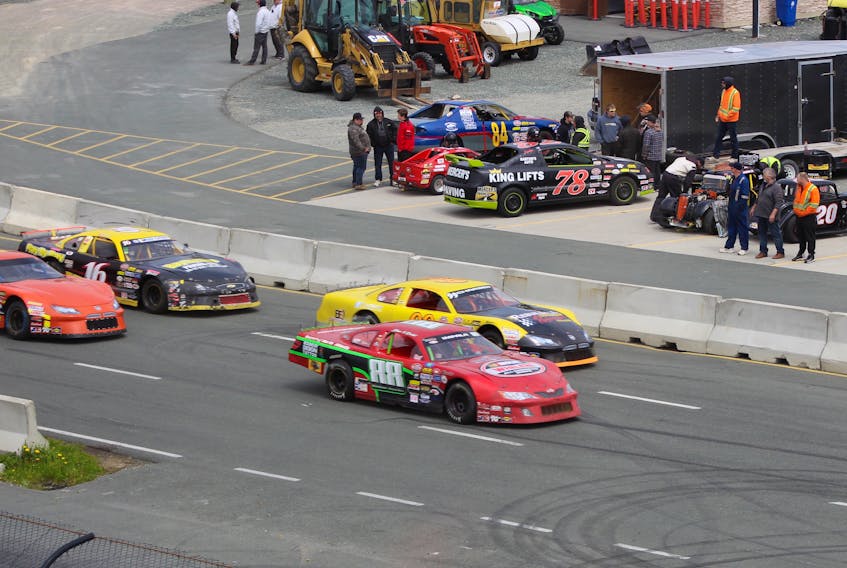Sam McNeish/The Telegram
Eventual race winner Wayne Walsh the No. 99 Dodge (inside right) brings the field to the green flag in the Outdoor Pros 75 at Eastbound Speedway on Sunday. Also shown are the No. 88 of Rachel Cole, the No. 16 of Ross Thorne and the No. 4 car of Robert Petten.