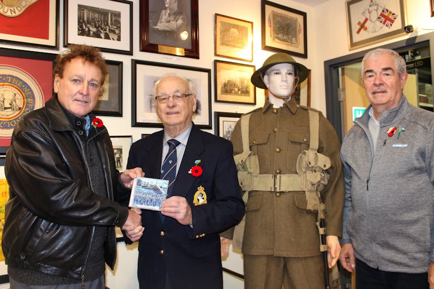 Irish singer/songwriter Danny O’Flaherty (left) presents a copy of his CD “It’s A Long Way From St. John’s,” to Royal Newfoundland Regiment museum committee member Capt. Ben Gardner (retired) at the museum on Thursday morning. O’Flaherty has donated 1,000 CDs to the museum to be sold with all proceeds go to support the museum. Also shown is Gary Browne, an historian and advisor to the Royal Newfoundland Regiment. Browne has written two books about the Regiment that helped inspire and guide O’Flaherty on the project.