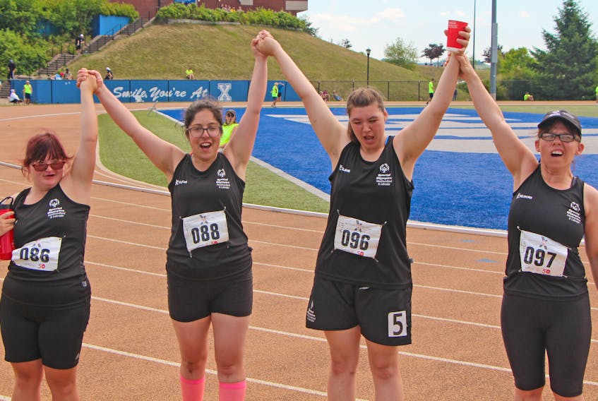 Their motto was “One team, one dream.” Team Newfoundland and Labrador athletes (from left) Sarah Bursey, Floressa Harris, Samantha Walsh and Crystal Young celebrate after finishing the female 4x100-metre race on Saturday,  the final day of competition at the Special Olympics Canada 2018 Summer Games in Antigonish, N.S..