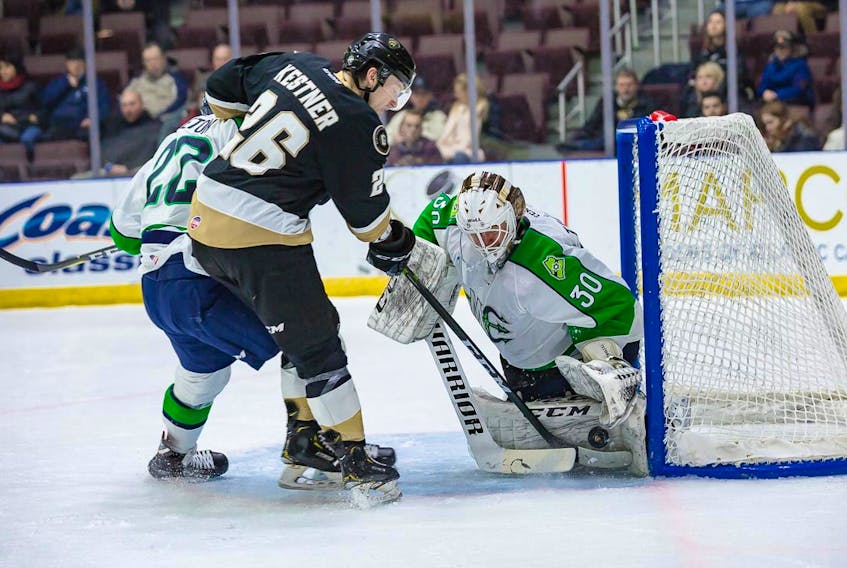 Newfoundland Growlers forward Joh Kestner tries to jam the puck by Maine Mariners goaltender Hannu Toivonen during ECHL action at Mile One Centre Tuesday night. Kestner was denied on this play, but did score a goal and added three assists as the Growlers prevailed 8-4. — Newfoundland Growlers photo/Jeff Parsons
