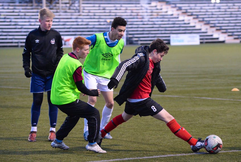 Members of Newfoundland and Labrador male under-18 soccer team work on a scrimmage drill Wednesday night at King George V Park in St. John’s. The team is preparing for the annual Atlantic Showcase tournament beginning Friday at KGV. Eight teams — four male and four female — will compete in a round robin format in an event scouted by university and colleges.